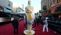 A massive Oscar is kept under wraps on the red carpet in preparation for this year's Academy Awards in Los Angeles. (Credit: PA)