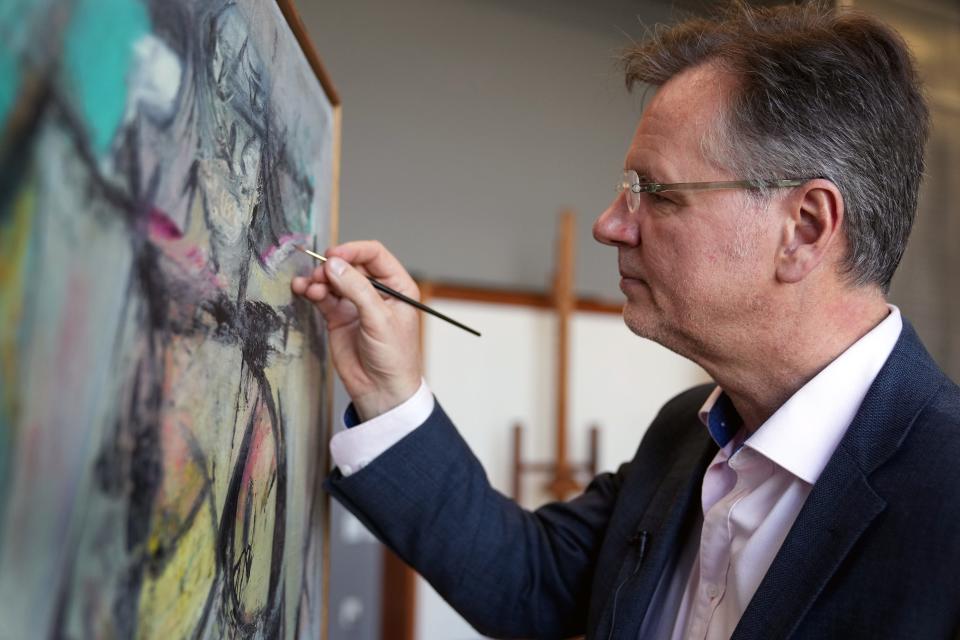 Ulrich Birkmaier, senior conservator of paintings at the Getty Museum in Los Angeles, does inpainting on u0022Woman-Ochre,u0022 an oil-on-canvas painting by Willem de Kooning on May 23, 2022.