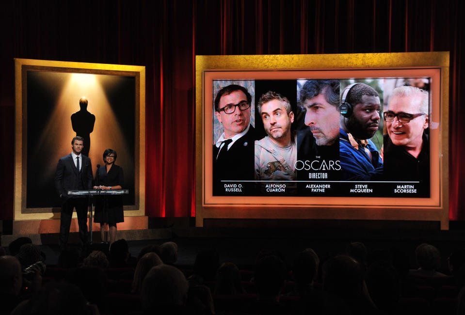 CORRECTS YEAR TO 2014 - Actor Chris Hemsworth, left, and President of the Academy Cheryl Boone Isaacs announce the Academy Awards nominations for Best Director at the 86th Academy Awards nomination ceremony on Thursday, Jan. 16, 2014 in Beverly Hills, Calif. The 86th Annual Academy Awards will take place on Sunday, March 2, at the Dolby Theatre in Los Angeles. (Photo by Vince Bucci/Invision/AP)