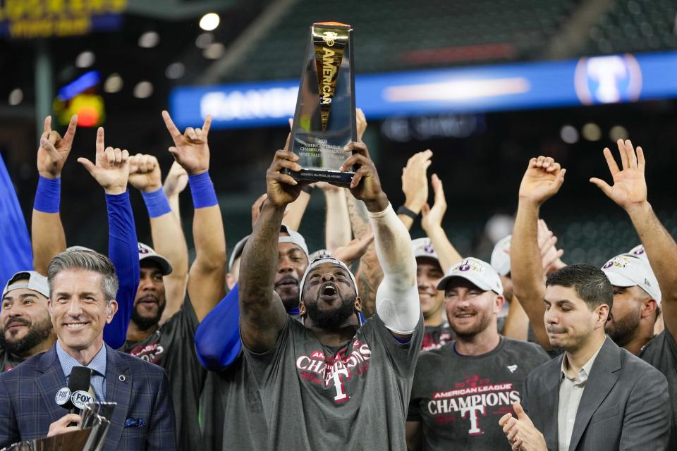 The Texas Rangers celebrate after Game 7 of the baseball AL Championship Series against the Houston Astros Monday, Oct. 23, 2023, in Houston. The Rangers won 11-4 to win the series 4-3. (AP Photo/David J. Phillip)