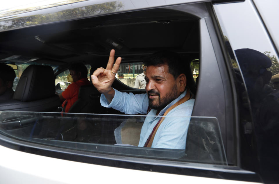 Brij Bhushan Saran Singh, an accused in the 1992 attack and demolition of a 16th century mosque, celebrates outside a court in Lucknow, India, Wednesday, Sept. 30, 2020. An Indian court on Wednesday acquitted all 32 accused, including senior leaders of the ruling Hindu nationalist Bharatiya Janata Party, in the case. The demolition sparked Hindu-Muslim violence that left some 2,000 people dead. (AP Photo/Rajesh Kumar Singh)