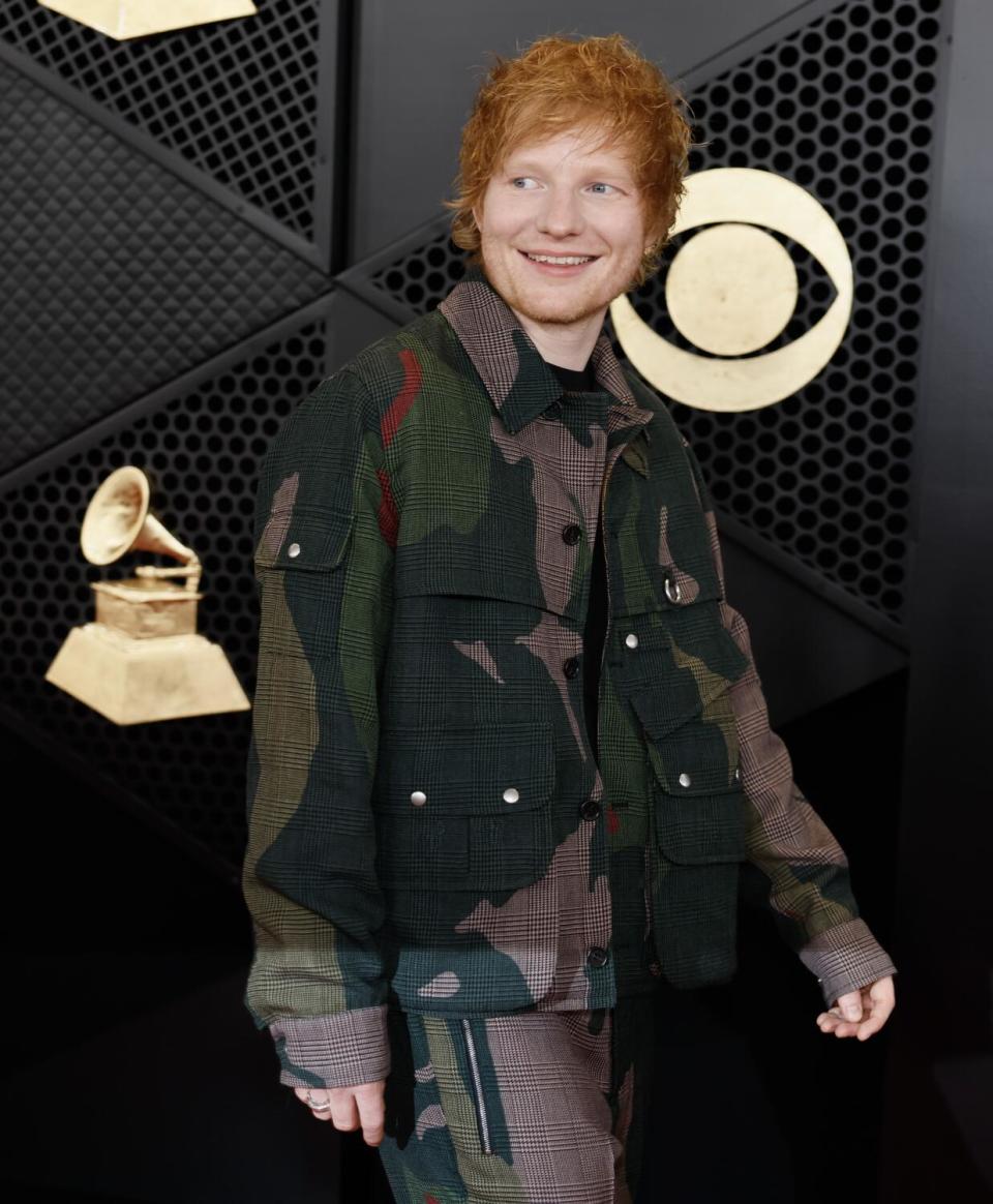 Ed Sheeran wears a camo jacket and pants