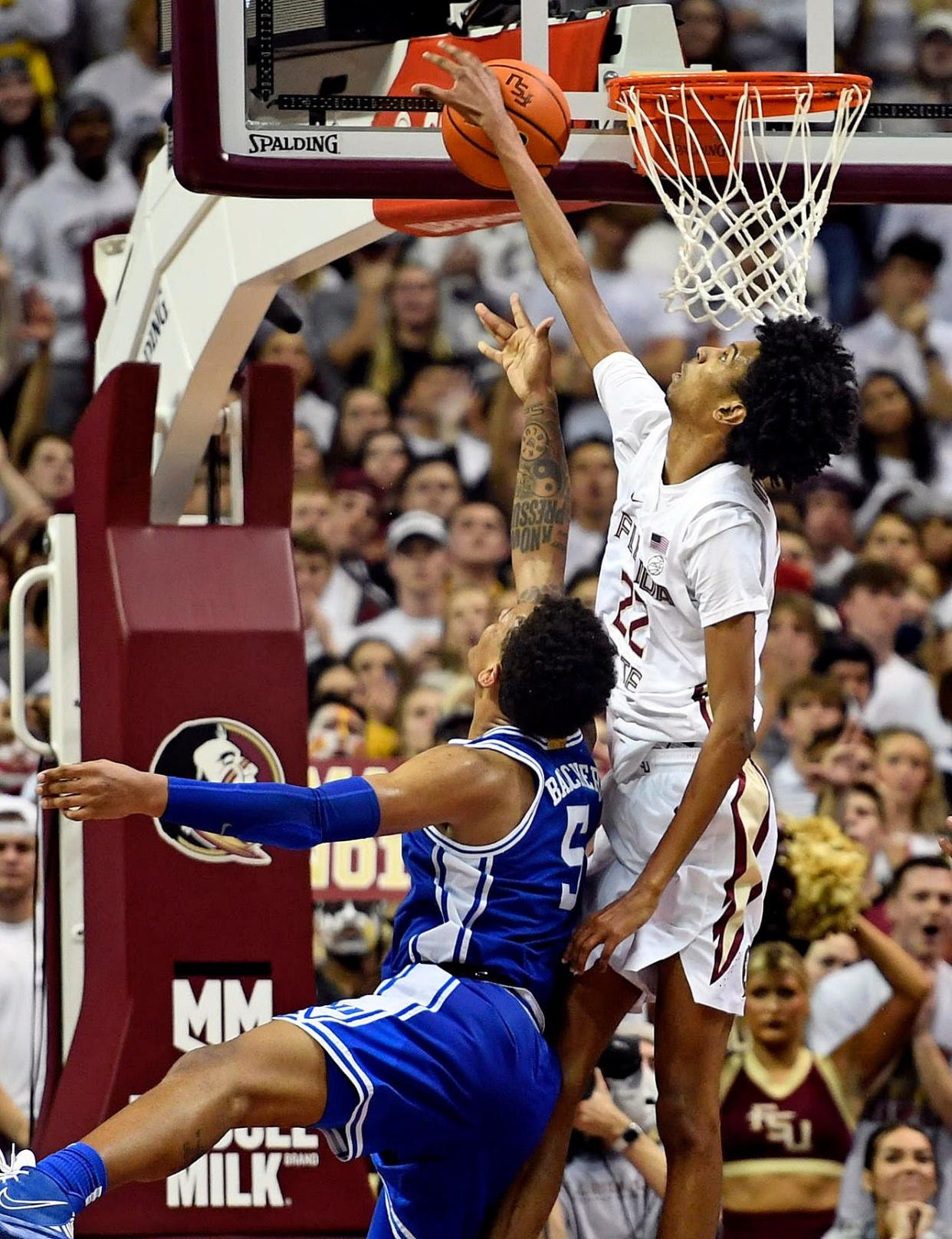 Florida State forward John Butler blocks a shot attempt by Duke's Paolo Banchero on Tuesday night in Tallahassee, Fla.