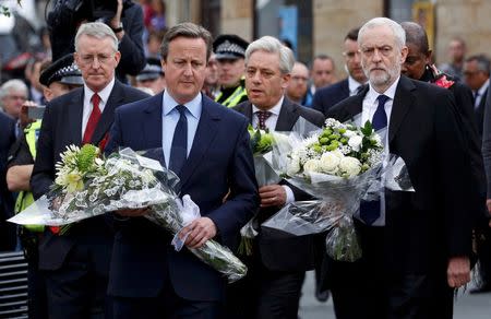 Britain's Prime Minister David Cameron (2nd L) leads Labour Party leader Jeremy Corbyn (R), John Bercow, Speaker of the House of Commons (2nd R) and Labour MP Hilary Benn (L) as they pay tribute near the scene where Labour Member of Parliament Jo Cox was killed in Birstall near Leeds, in Britain June 17, 2016. REUTERS/Craig Brough