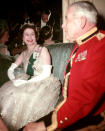 <p>Dressed in her finest jewels and a stunning beaded dress, the Queen is glowing in this photo - taken at the banquet of the 16th/5th Royal Lancers Regiment at London’s Hyde Park Hotel. <i>[Photo: Rex/Reginald Davis]</i></p>