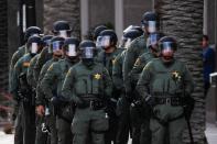 Law enforcement officers stand guard as demonstrators take part in a demonstration against the death in Minneapolis police custody of George Floyd, in Anaheim