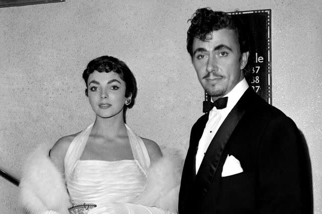 <p>Daily Mirror/Mirrorpix via Getty</p> Joan Collins and Maxwell Reed at the premiere of the film 'Sudden Fear' in September 1952