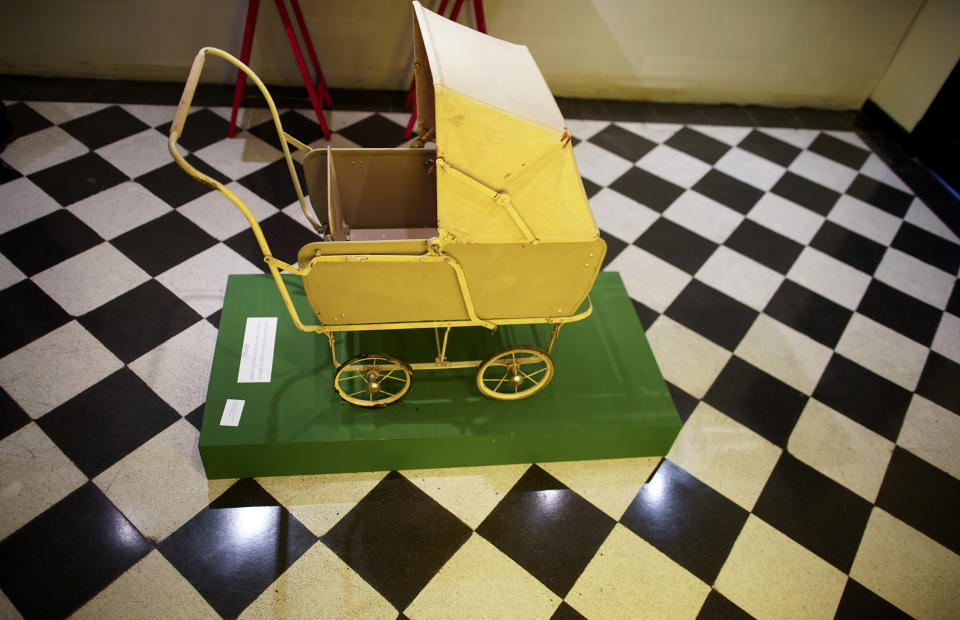 A toy baby carriage of the "Childhood and Peronism, the toys of the Eva Perón Foundation" exhibit is displayed at the Evita Museum in Buenos Aires, Argentina Wednesday, April 17, 2019. Long before politicians started using social media platforms to influence public opinion, Peronism adopted a different strategy: handing out toys, like this baby carriage, to 4 million children from Argentina's poorest families. (AP Photo/Natacha Pisarenko)