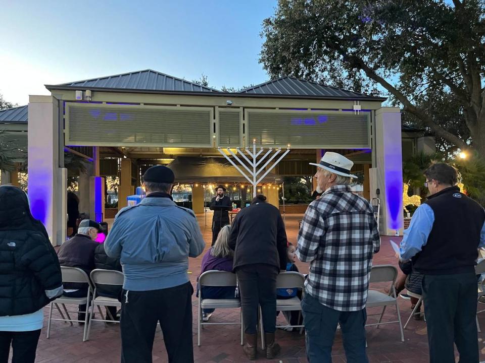 Residents gather for a Hanukkah celebration at Beaufort Waterfront Park Thursday.