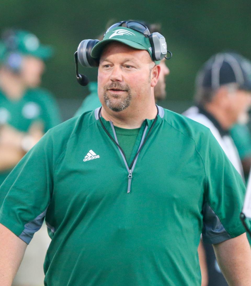 Seahawks head coach Phil Tisa talks with players during a time out in the South Walton Walton spring football scrimmage played at Walton High.