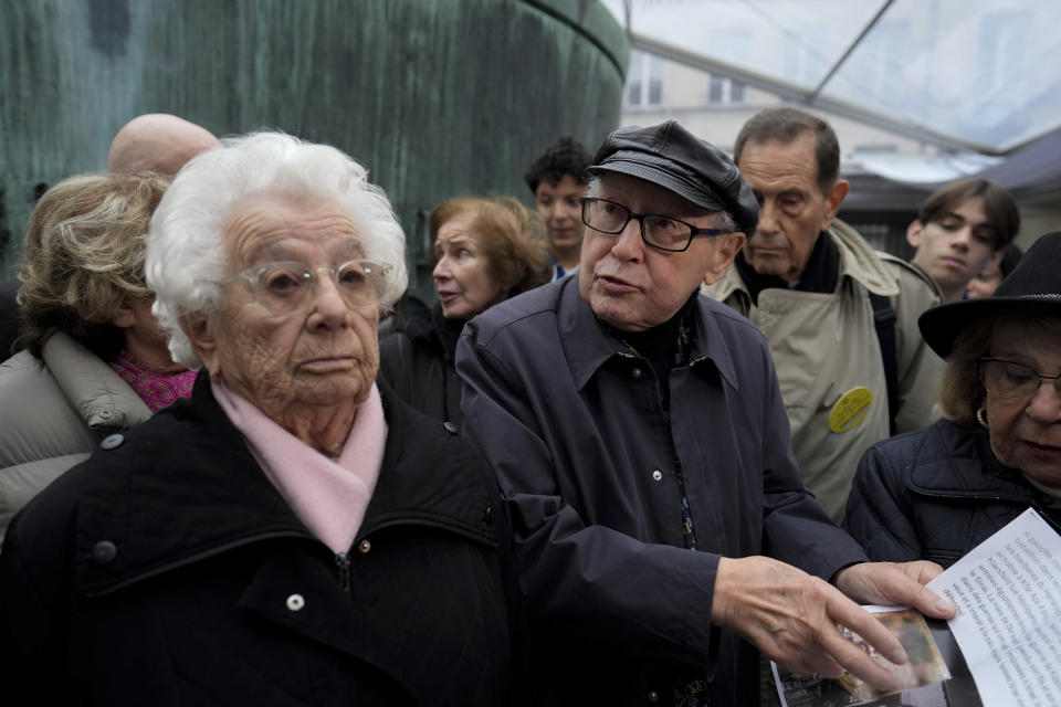 French nazi hunter Serge Klarsfeld, center right, and Auschwitz concentration camp survivor Esther Senot, left, attend a gathering in the Paris Holocaust memorial to sound the alarm about resurgent antisemitic hate speech, graffiti and abuse linked to the Israel-Hamas war, in Paris, Saturday, Nov. 18, 2023. rance's Interior Ministry said this week that 1,762 antisemitic acts have been reported this year, as well as 131 anti-Muslim acts and 564 anti-Christian acts. (AP Photo/Thibault Camus)