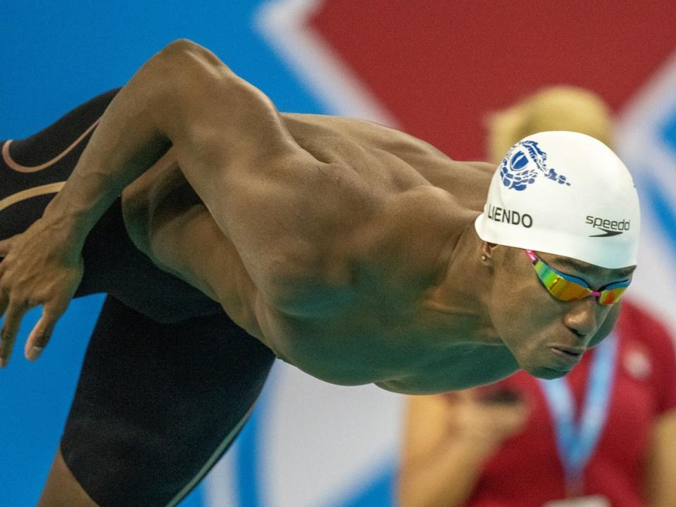 Canada's Josh Liendo blasts off the start block on his way to winning the men's 100-metre butterfly at national swimming trials in Toronto on Wednesday. (Frank Gunn/The Canadian Press - image credit)