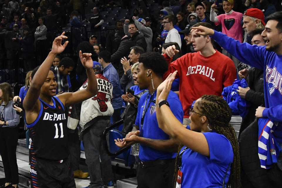 DePaul guard Charlie Moore (11) greets fans after an NCAA college basketball game against Butler Saturday, Jan. 18, 2020, in Chicago. DePaul won 79-66. (AP Photo/Matt Marton)
