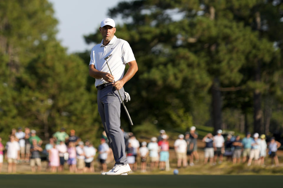 Scottie Scheffler reacts after missing a putt on the 12th hole during the second round of the U.S. Open golf tournament Friday, June 14, 2024, in Pinehurst, N.C. (AP Photo/George Walker IV)