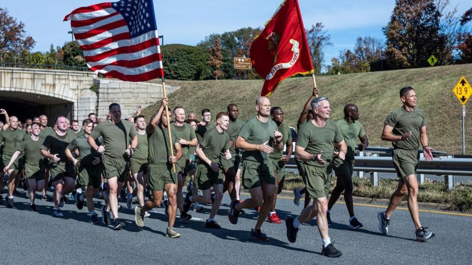 Gen. Christopher Mahoney and Sergeant Major of the Marine Corps Carlos Ruiz lead Marines in a run in honor of the Marine Corps' 248th birthday in Arlington, Virginia., Nov. 8. (Lance Cpl. Joseph DeMarcus/Marine Corps)  