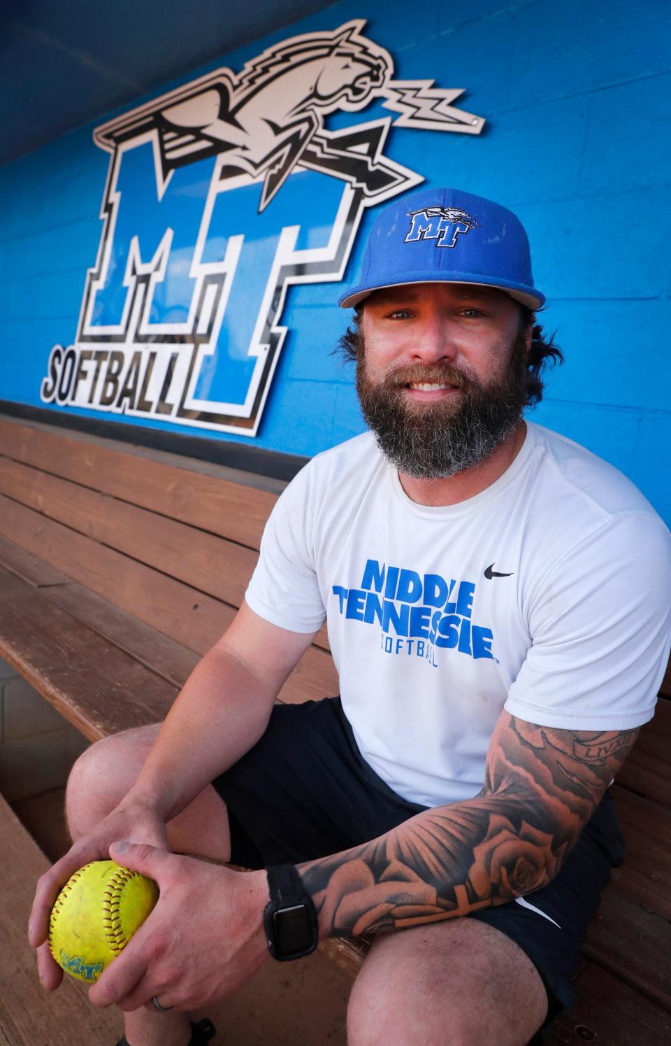 Former MTSU baseball great Bryce Brentz sits in the Lady Raider softball dugout before a recent practice. Brentz has been the team's hitting coach this season.