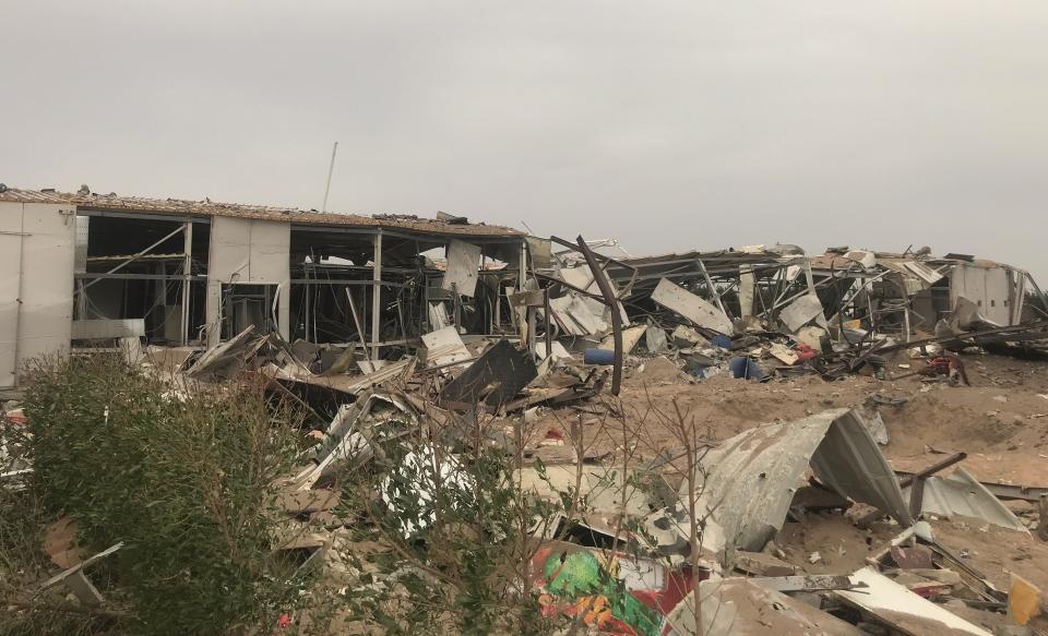 Destroyed buildings are seen at an airport complex under construction in Karbala, Iraq, Friday, March 13, 2020. Iraq's military said five security force members and a civilian were killed early Friday in a barrage of U.S. airstrikes, which were launched hours after a rocket attack killed and wounded American and British servicemen at a base north of Baghdad. (AP Photo/Anmar Khalil)