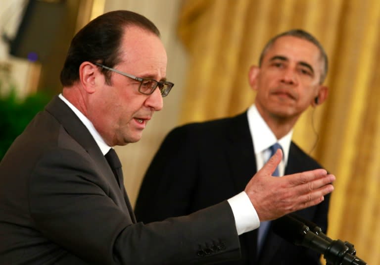 US President Barack Obama (R) and French President Francois Hollande hold a joint news conference after their meeting at the White House in Washington, DC on November 24, 2015