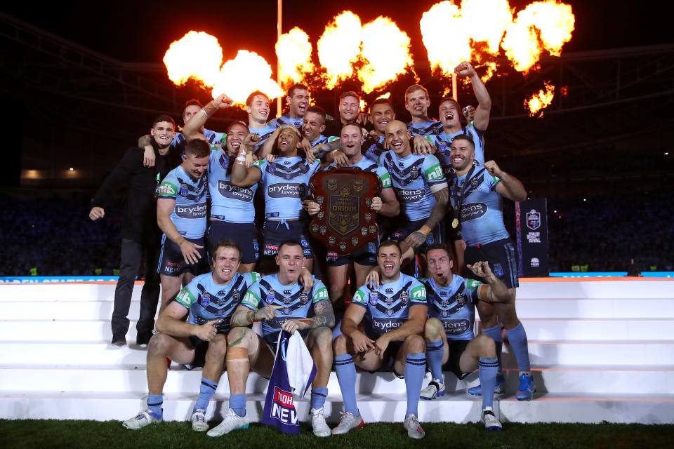 The NSW Blues celebrate retaining the State of Origin trophy.