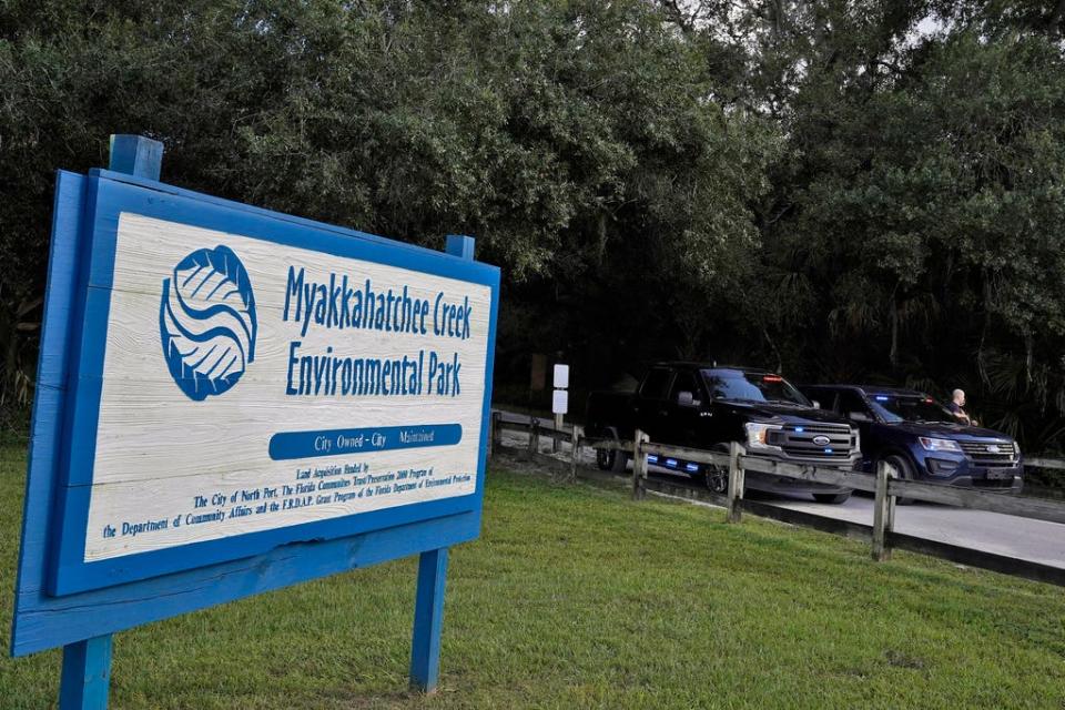 North Port, Fla., police officer block the entrance to the Myakkahatchee Creek Environmental Park Wednesday, Oct. 20, 2021, in North Port, Fla. Items believed to belong to Brian Laundrie and potential human remains were found in a Florida wilderness park during a search for clues in the slaying of Gabby Petito .