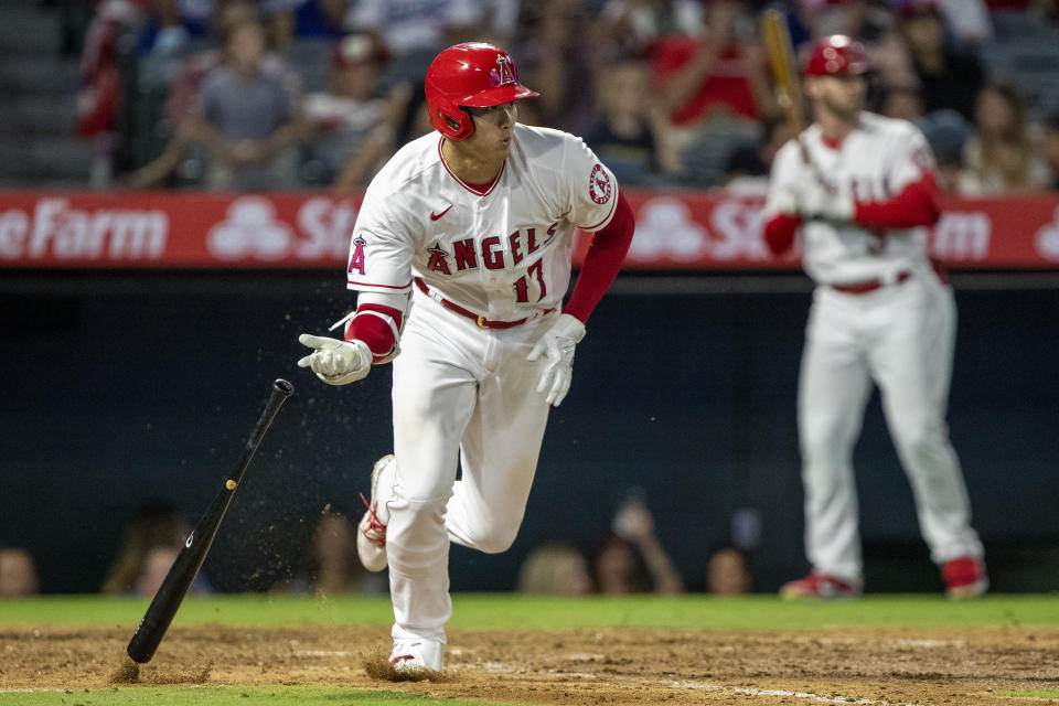 Los Angeles Angels' Shohei Ohtani runs to first after hitting a single against the Los Angeles Dodgers during the eighth inning of a baseball game in Anaheim, Calif., Saturday, July 16, 2022. (AP Photo/Alex Gallardo)