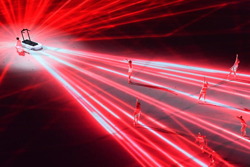 <p>An overview shows dancers perform during the opening ceremony of the Tokyo 2020 Olympic Games, at the Olympic Stadium, in Tokyo, on July 23, 2021. (Photo by Antonin THUILLIER / AFP) (Photo by ANTONIN THUILLIER/AFP via Getty Images)</p> 