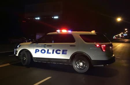 A police car blocks access to the scene of a mass shooting at the Cameo Nightlife club in Cincinatti, Ohio, U.S. March 26, 2017. REUTERS/Caleb Hughes