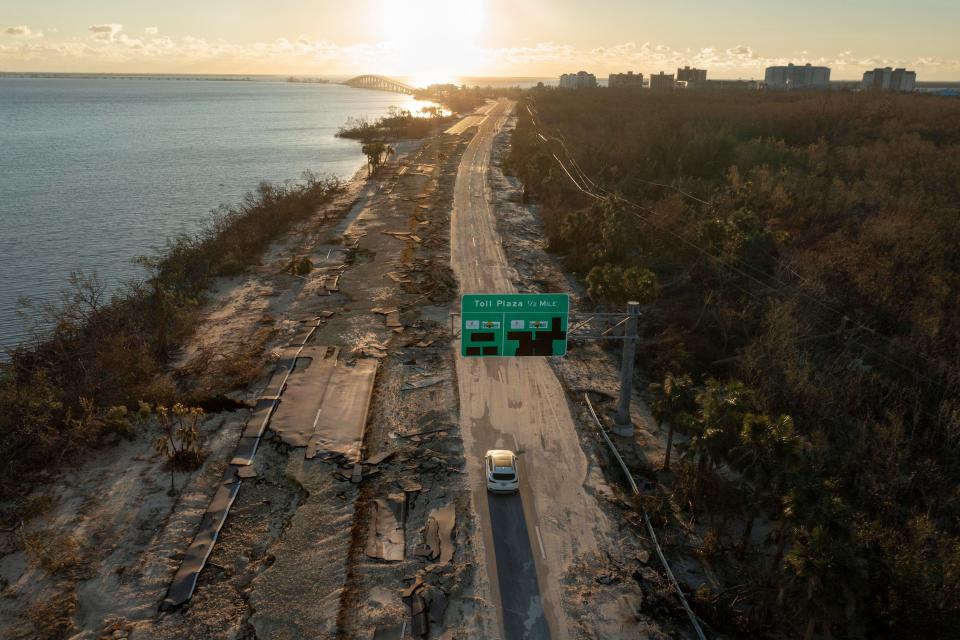 The road leading to Sanibel Causeway was damaged after Hurricane Ian passed through the area on Sept, 29, 2022 in Sanibel, Fla.