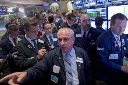 Traders gather at the post that trades Allergan stock on the floor of the New York Stock Exchange October 29, 2015. REUTERS/Brendan McDermid