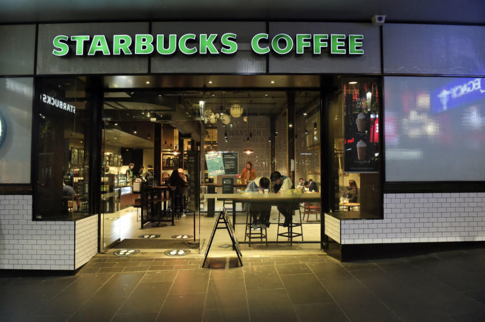 Customers observe social distancing measures at a Starbucks Corp. coffee shop in Melbourne, Australia, on Wednesday, Jul 8, 2020. Victoria's government said from midnight Wednesday people in the nationâs second-most populous city must stay home except for work, essential services, medical treatment or school -- returning to curbs that were lifted weeks ago across the country. Photographer: Carla Gottgens/Bloomberg