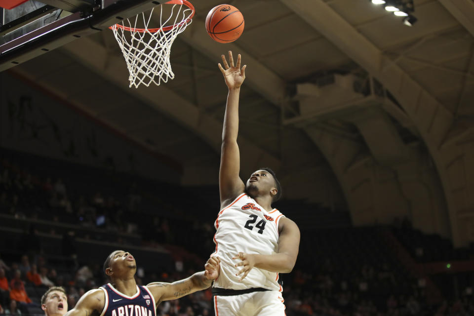 Oregon State center KC Ibekwe (24) shoots over Arizona forward Keshad Johnson (16) during the first half of an NCAA college basketball game Thursday, Jan. 25, 2024, in Corvallis, Ore. (AP Photo/Amanda Loman)