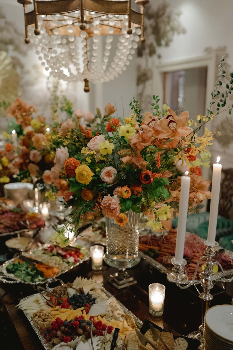 a table with flowers and candles