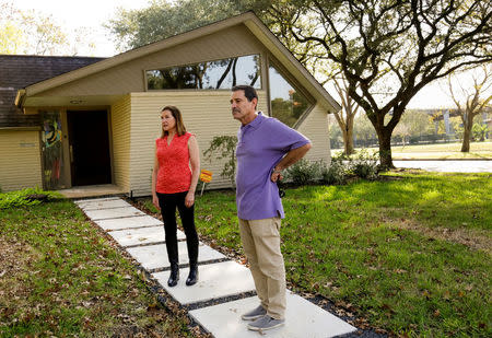 Residents Joel and Melinda Loshak discuss damage as a result of Hurricane Harvey in Houston, Texas, U.S. November 12, 2017. Picture taken November 12, 2017. REUTERS/William Philpott