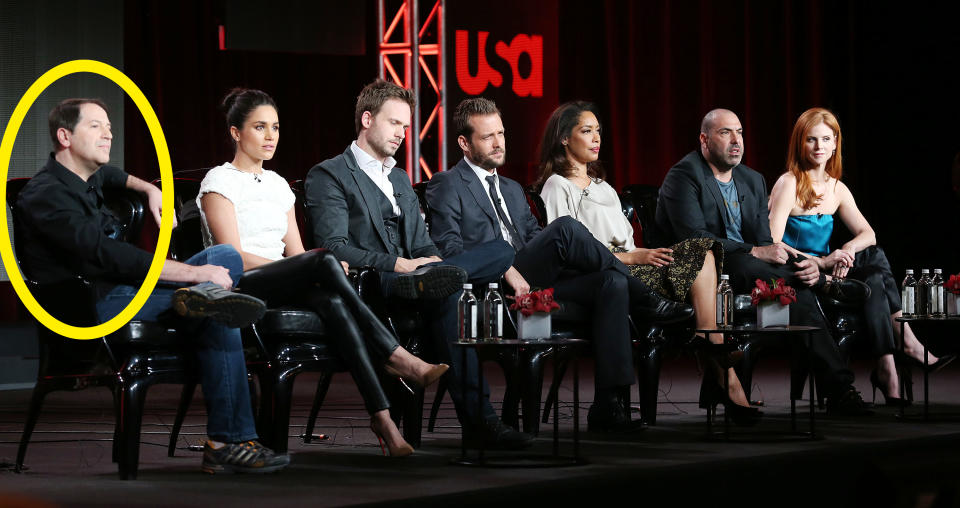 A circle around Aaron Korsh who's sitting on stage with the cast of the original show