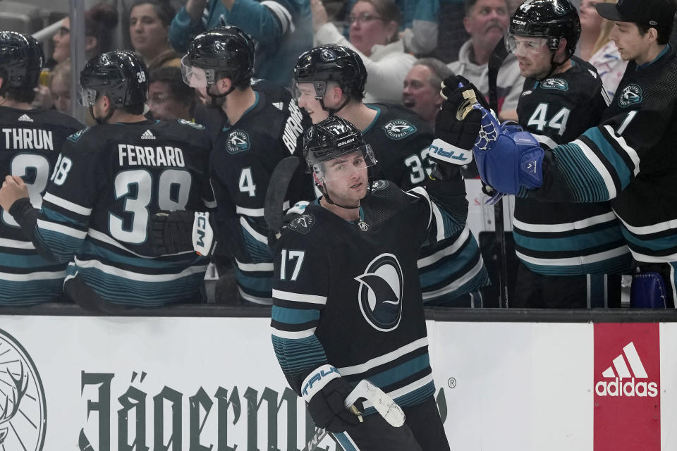 San Jose Sharks center Thomas Bordeleau (17) is congratulated by teammates after scoring against the Ottawa Senators during the second period of an NHL hockey game in San Jose, Calif., Saturday, March 9, 2024. (AP Photo/Jeff Chiu)