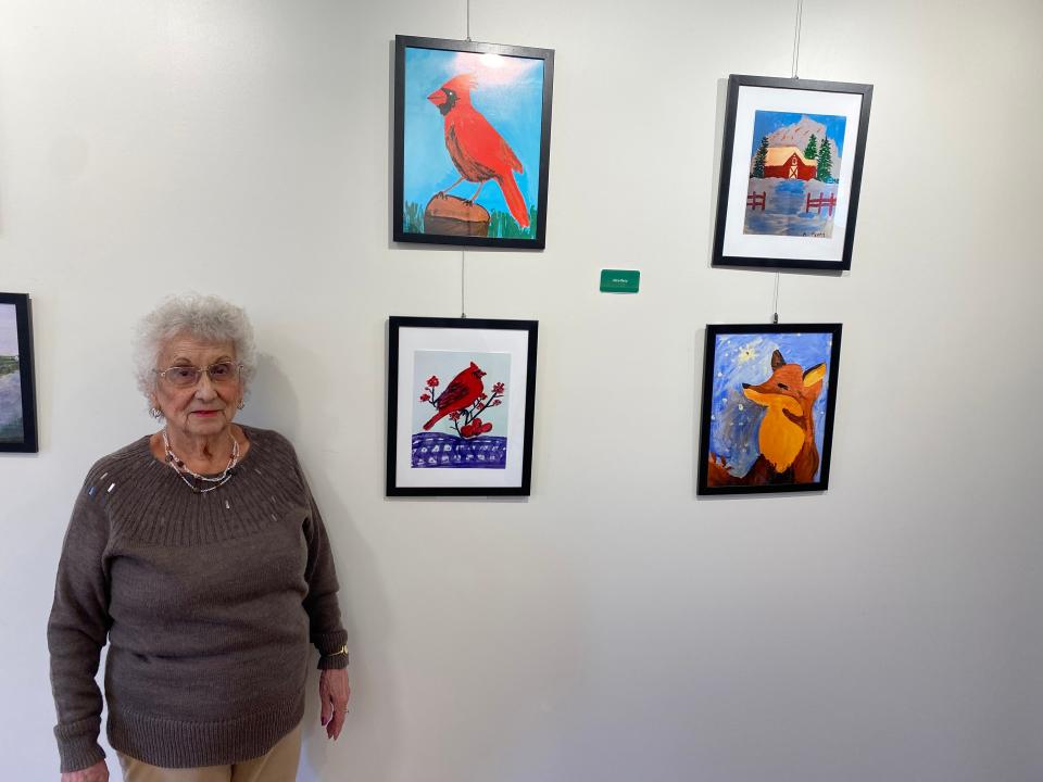 Alice Perry, has some of her paintings hanging up inside the art gallery at her senior living facility, The Residence at Great Woods, in Norton, on March 27, 2024. She turned 100 on April 8, 2024.