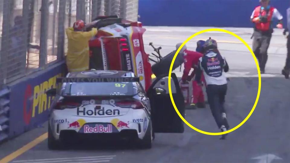 Shane van Gisbergen hops out of his car and runs to check on rival Scott McLaughlin after a horror crash.