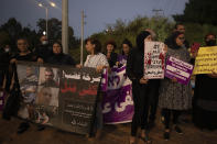 Protesters hold signs and chant slogans during a demonstration against violence near the house of Public Security Minister Omer Barlev in the central Israeli town of Kokhav Ya'ir, Saturday, Sept. 25, 2021. Arab citizens of Israel are seeking to raise awareness about the spiraling rate of violent crime in their communities under the hashtag "Arab lives matter," but unlike a similar campaign in the United States, they are calling for more policing, not less. Arabic reads: "Cry of anger, enough killing." (AP Photo/Sebastian Scheiner)