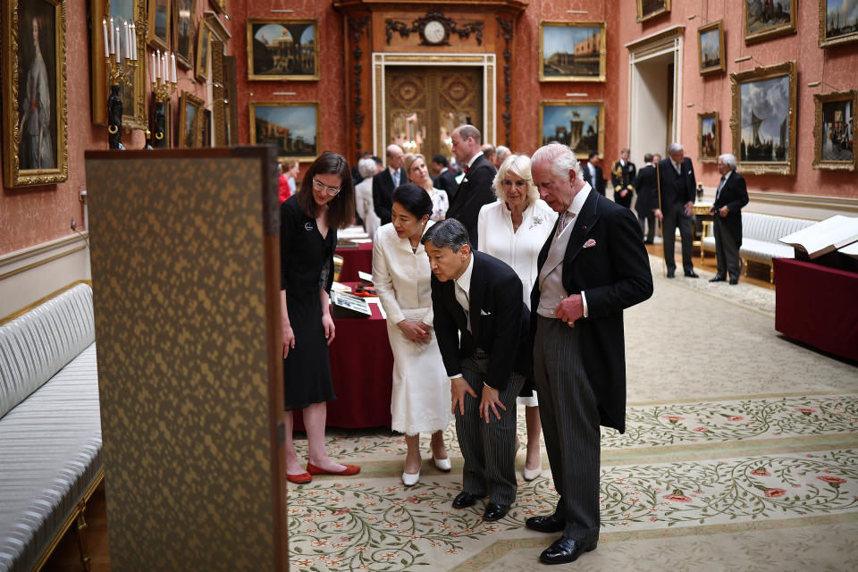 King Charles III walks with Japan's Emperor Naruhito, Queen Camilla and Japan's Empress Masako as they view a display of Japanese items from the Royal Collection in the Picture Gallery at Buckingham Palace on June 25.<span class="copyright">Henry Nicholls—WPA Pool/Getty Images</span>