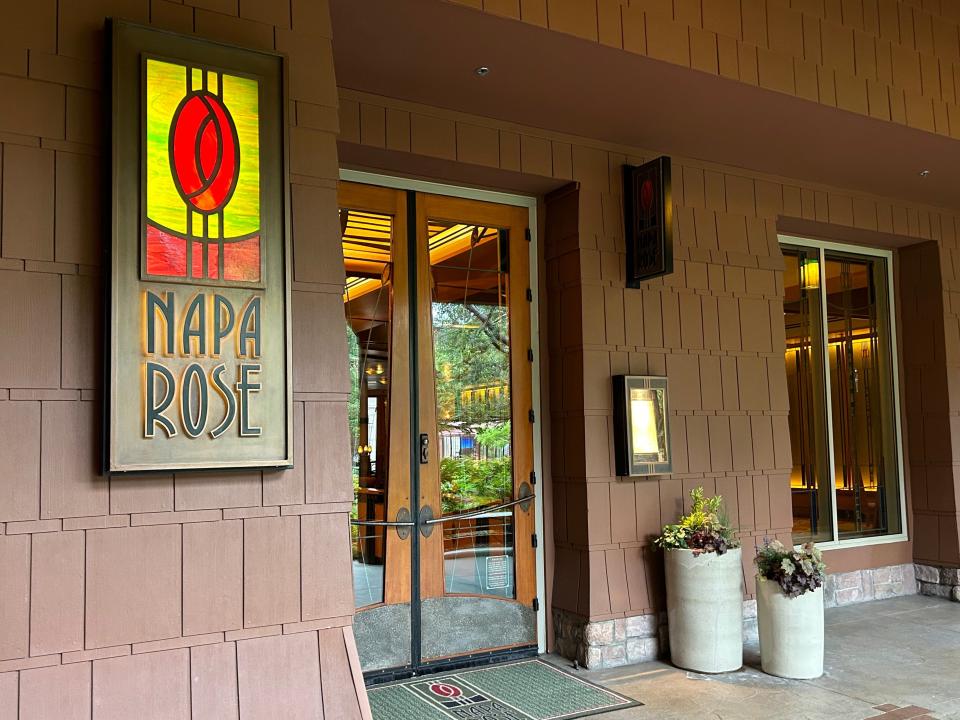 The exterior of a building with a stained-glass sign that reads "Napa Rose."