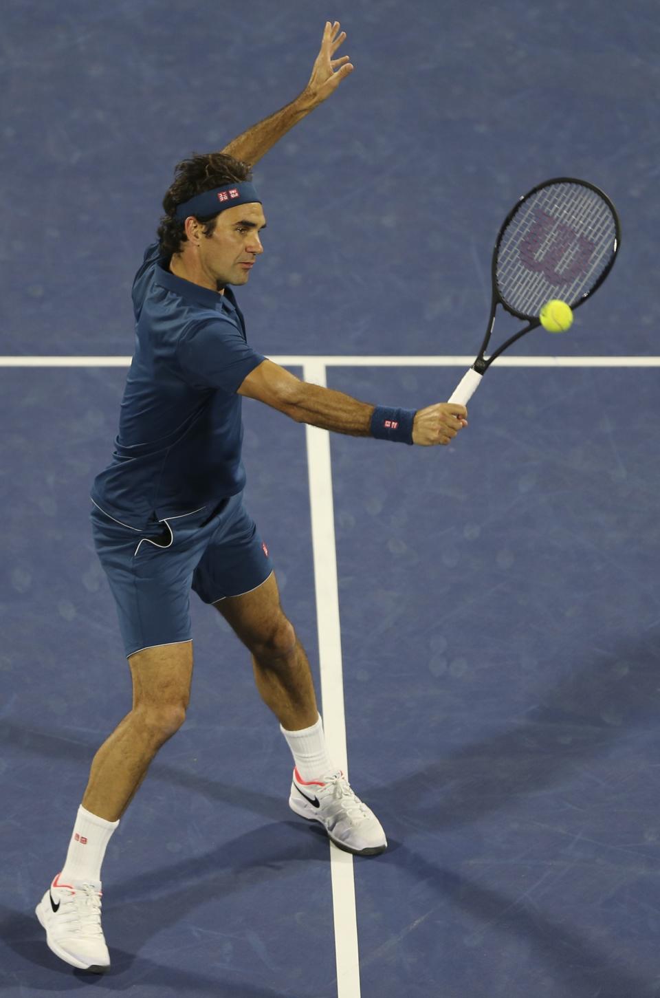 Roger Federer of Switzerland returns the ball to Stefanos Tsitsipas of Greece during their final match at the Dubai Duty Free Tennis Championship, in Dubai, United Arab Emirates, Saturday, March 2, 2019. (AP Photo/Kamran Jebreili)