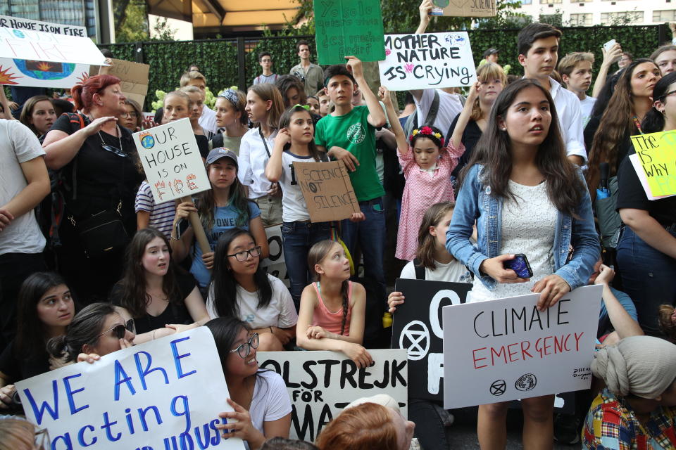 Swedish environmental activist Greta Thunberg, lower center, participates in a Youth Climate Strike outside the United Nations, Friday, Aug. 30, 2019 in New York. Thunberg is scheduled to address the United Nations Climate Action Summit on September 23. (AP Photo/Mary Altaffer)
