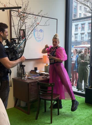 <p>Hedy Phillips </p> Busy Philipps painting at her garage sale