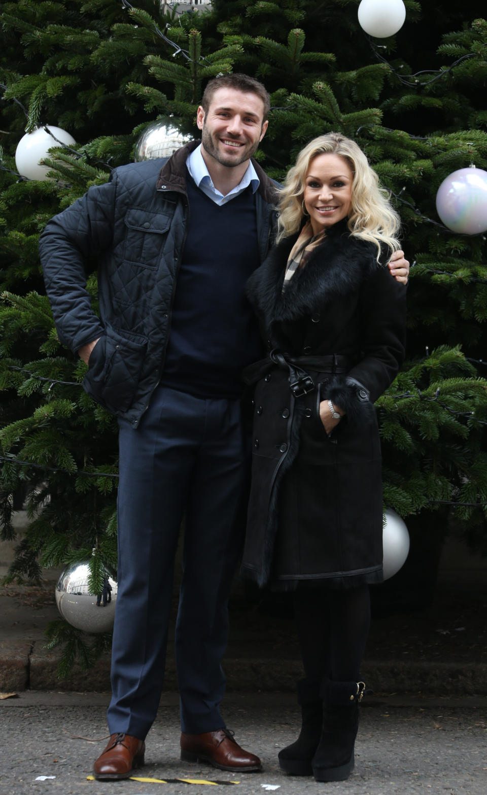 Former England rugby union player Ben Cohen and his Strictly Come Dancing partner Kristina Rihanoff arrive by the Christmas Tree in Downing Street for the Christmas charity parties for number 10 and 11, in central London, Monday, Dec. 9, 2013. (Photo by Joel Ryan/Invision/AP)