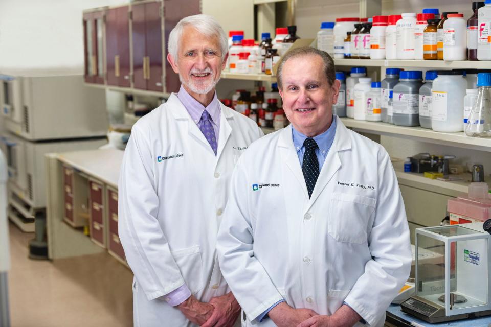 Cleveland Clinic researchers Dr. G. Thomas Budd, M.D., and Vincent Tuohy stand in a lab.