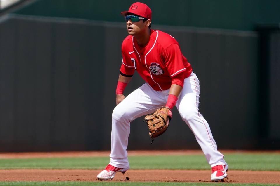 Cincinnati Reds third baseman Donovan Solano (7) gets set for a pitch during a spring training game against the San Francisco Giants, Sunday, March 20, 2022, at Goodyear Ballpark in Goodyear, Ariz.