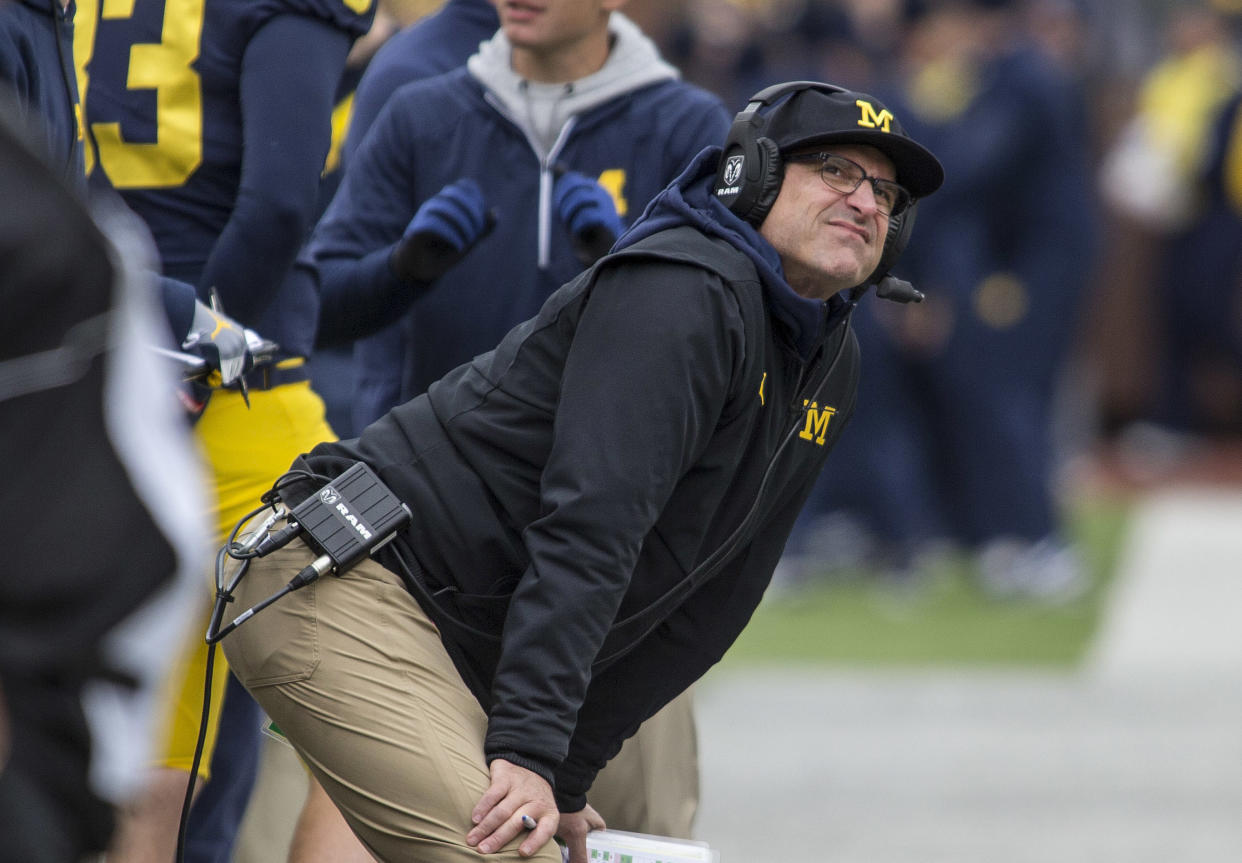 Michigan coach Jim Harbaugh reportedly flew down to Mississippi on Tuesday to recruit some Ole Miss players. (AP Photo/Tony Ding, File)