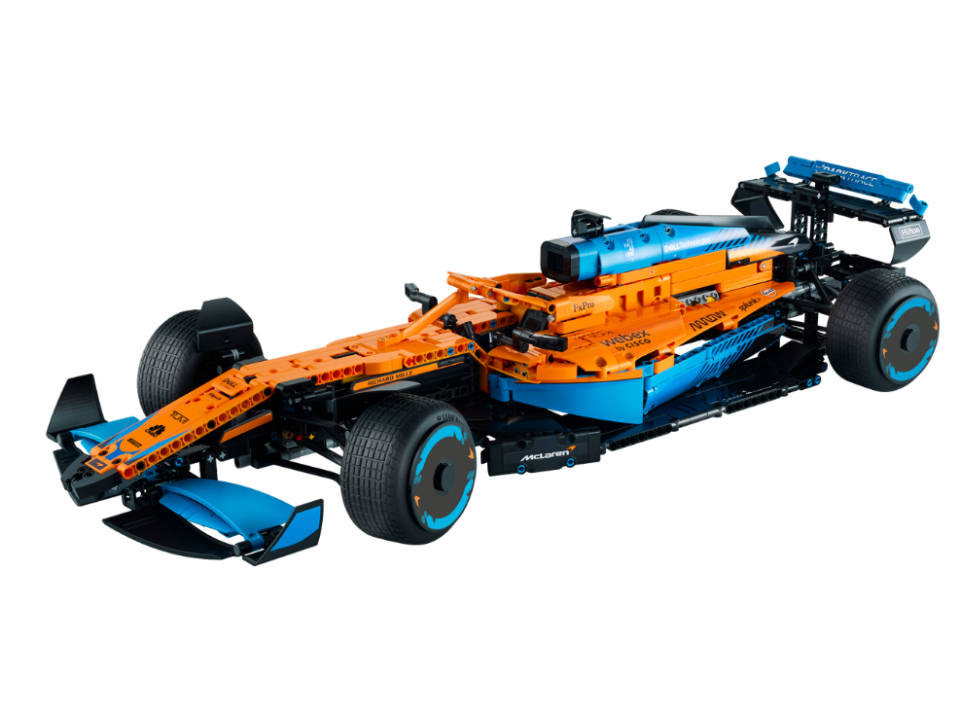 mclaren f1 lego car orange and blue on white background