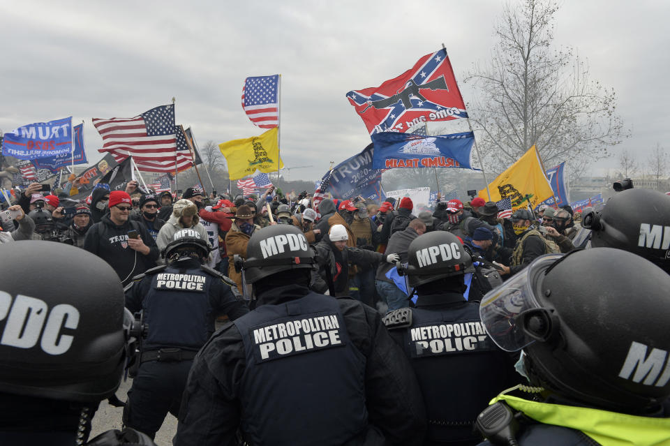 Trump supporters clash with police and security forces as they storm the US Capitol in Washington D.C on January 6, 2021. - Demonstrators breeched security and entered the Capitol as Congress debated the a 2020 presidential election Electoral Vote Certification. (Photo by JOSEPH PREZIOSO/AFP via Getty Images)