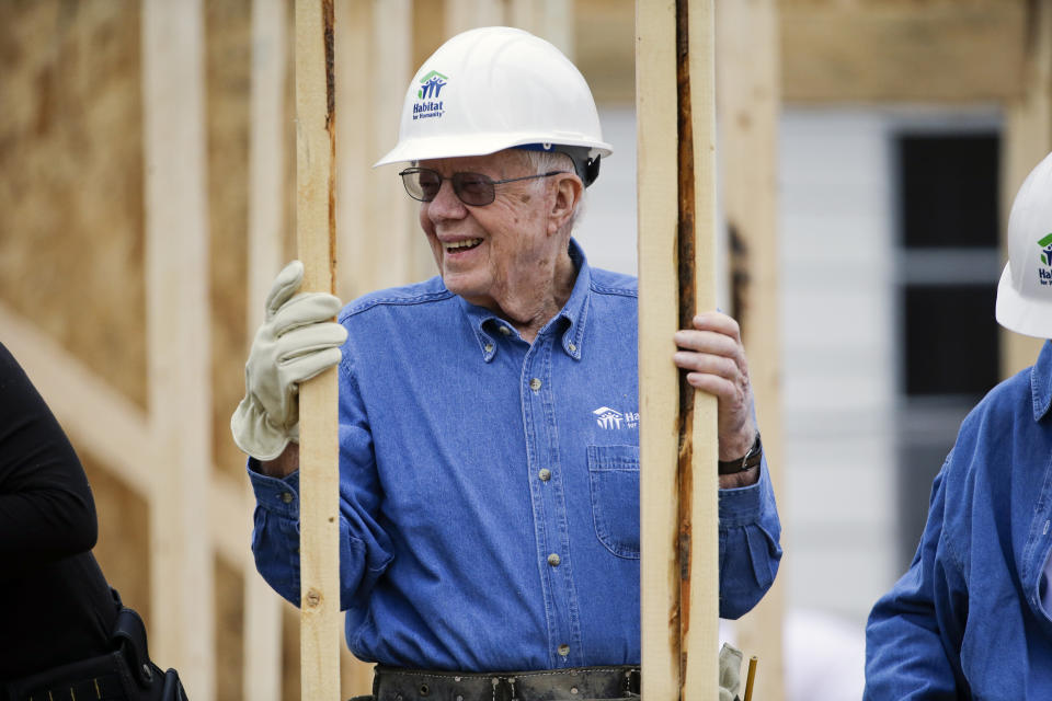 FILE - In this Nov. 2, 2015, file photo, former President Jimmy Carter works at a Habitat for Humanity building site in Memphis, Tenn. Carter is sometimes called a better former president than he was president. The backhanded compliment has always rankled Carter allies and, they say, the former president himself. Yet now, 40 years removed from the White House, the most famous resident of Plains, Georgia, is riding a new wave of attention as biographers, filmmakers, climate activists and Carter’s fellow Democrats push for a recasting of his presidential legacy. (AP Photo/Mark Humphrey, File)